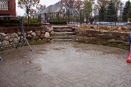 Boulder Retaining Wall, Interlocking Paver Patio, Drainage System