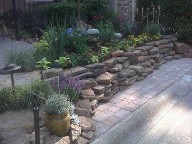 Houston, Texas, Retaining Wall, Drainage system, Outdoor Lighting, Brick Pavers, Steps, Raised Patio, Bench Seating, Pool Surrounding, Landscaping
