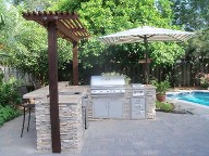 Houston, Texas outdoor kitchen, Brick Paver Patio, Retaining Wall, Drainage System, Fire Pit, Pergola