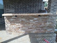 League City, Texas outdoor kitchen, Brick Paver Patio, Retaining Wall, Drainage System, Fire Pit, Pergola
