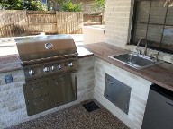 Bay Oaks, Houston Texas. Outdoor Kitchen, Drainage system, Belgards Brick Paver Patio, Retaining Wall