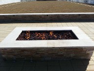 Galveston Island Fire Pit, Brick Paver Patio, Drainage System, Bench Seating, Retaining Wall, Landscape Lighting