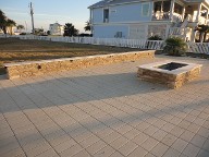 Galveston Island Fire Pit, Brick Paver Patio, Drainage System, Bench Seating, Retaining Wall, Landscape Lighting