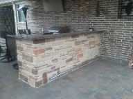 Pearland, Texas Outdoor Kitchen Retaining Wall, Step System, Brick Paver Patio, Drainage System, Fire Pit, Fire Place